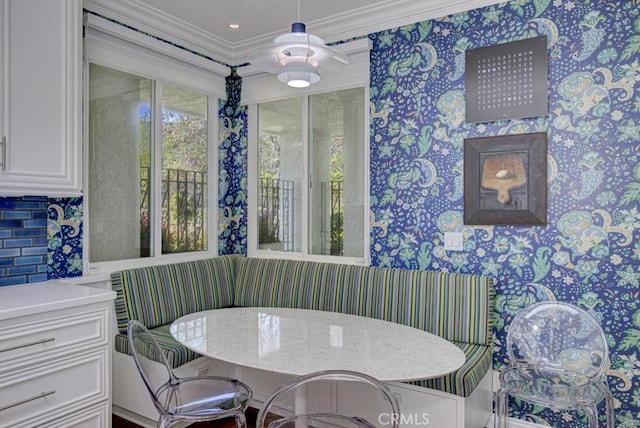 5594 Avenida Sosiega W Unit B, Laguna Woods, CA 92637 - dining space with ornamental molding, breakfast area, and wallpapered walls