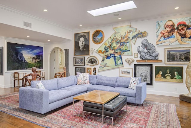 5594 Avenida Sosiega W Unit B, Laguna Woods, CA 92637 - living room featuring visible vents, a skylight, wood finished floors, ornamental molding, and recessed lighting