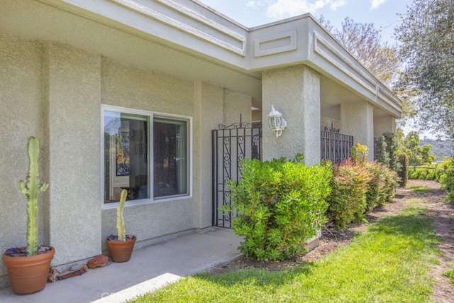5594 Avenida Sosiega W Unit B, Laguna Woods, CA 92637 - doorway to property featuring stucco siding