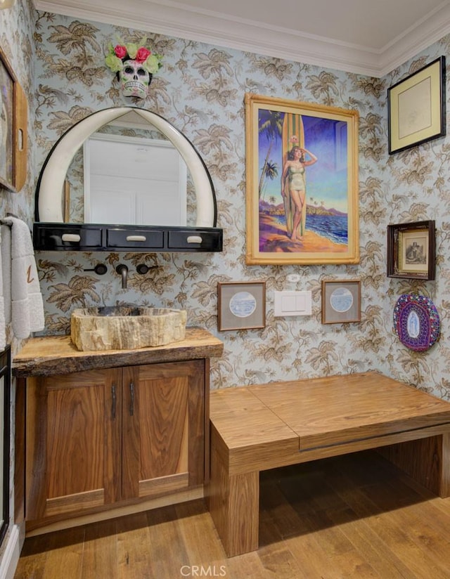 5594 Avenida Sosiega W Unit B, Laguna Woods, CA 92637 - bathroom with vanity, wallpapered walls, and hardwood / wood-style floors