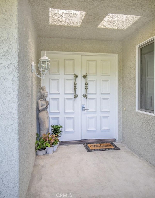 5594 Avenida Sosiega W Unit B, Laguna Woods, CA 92637 - property entrance featuring stucco siding