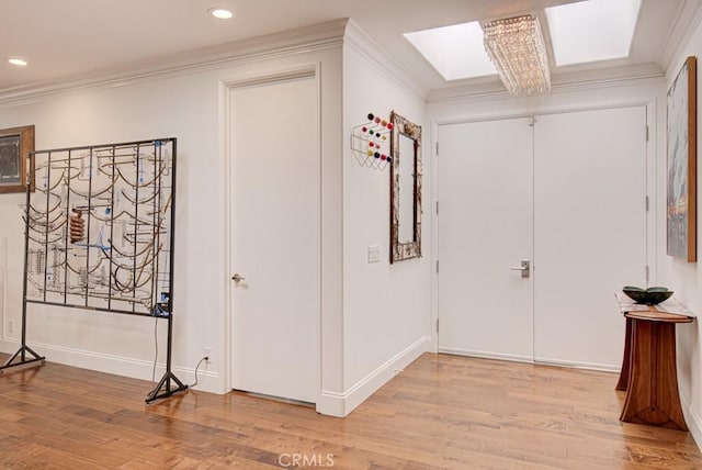5594 Avenida Sosiega W Unit B, Laguna Woods, CA 92637 - hall with recessed lighting, ornamental molding, wood finished floors, and a skylight
