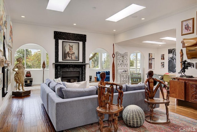5594 Avenida Sosiega W Unit B, Laguna Woods, CA 92637 - living room with wood finished floors, a skylight, and a fireplace