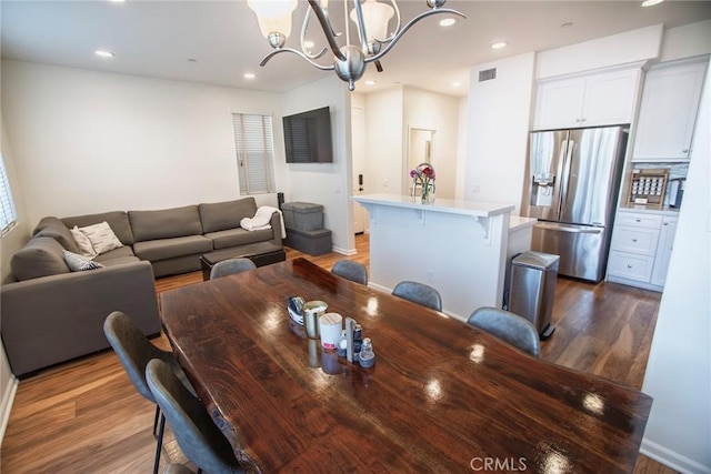 dining area with recessed lighting, a notable chandelier, dark wood-style floors, and visible vents