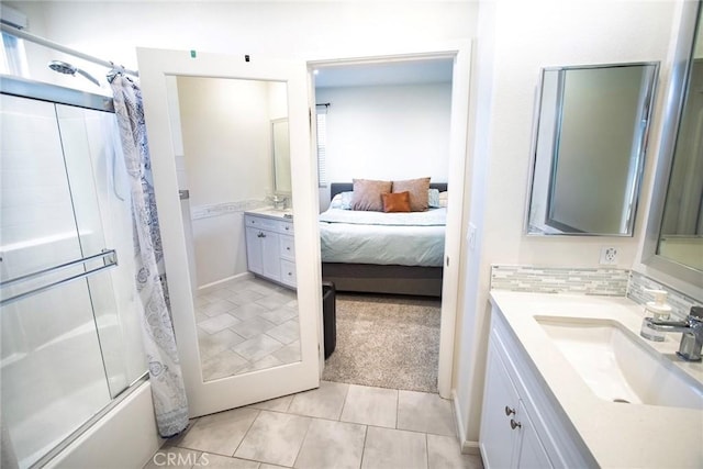 ensuite bathroom with vanity, tile patterned flooring, ensuite bathroom, and combined bath / shower with glass door
