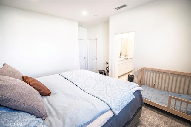 carpeted bedroom with recessed lighting and visible vents