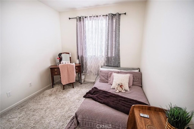 carpeted bedroom with baseboards