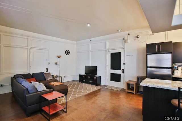 215 W 7th St Unit 803, Los Angeles, CA 90014 - living area featuring concrete floors and a decorative wall