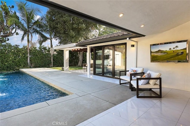 outdoor pool with a patio