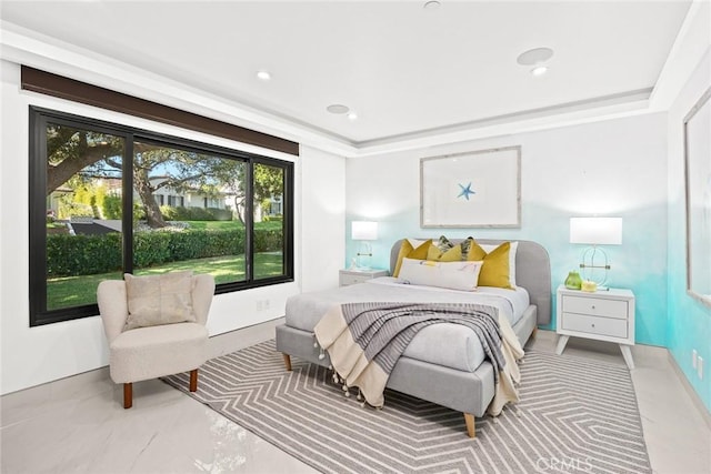 bedroom with a tray ceiling and recessed lighting