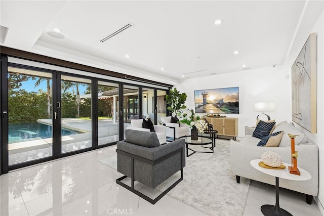 living area featuring french doors, recessed lighting, and visible vents