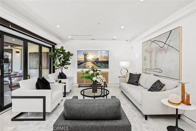 living room featuring recessed lighting and baseboards