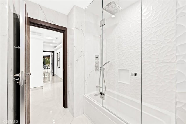 bathroom with enclosed tub / shower combo and marble finish floor