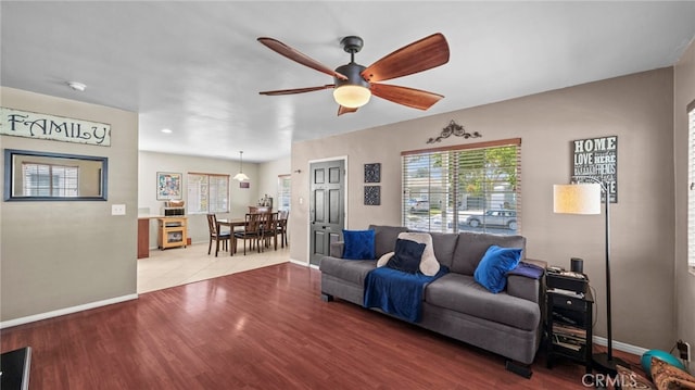 6048 Fidler Ave, Lakewood, CA 90712 - living area with a ceiling fan, baseboards, and wood finished floors