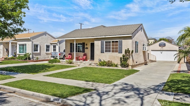 6048 Fidler Ave, Lakewood, CA 90712 - view of front of home featuring an outdoor structure, stucco siding, a detached garage, and a front yard