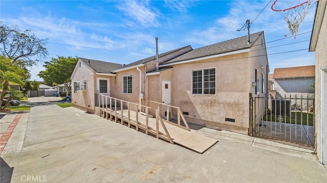 6048 Fidler Ave, Lakewood, CA 90712 - back of property featuring stucco siding, crawl space, and a shingled roof