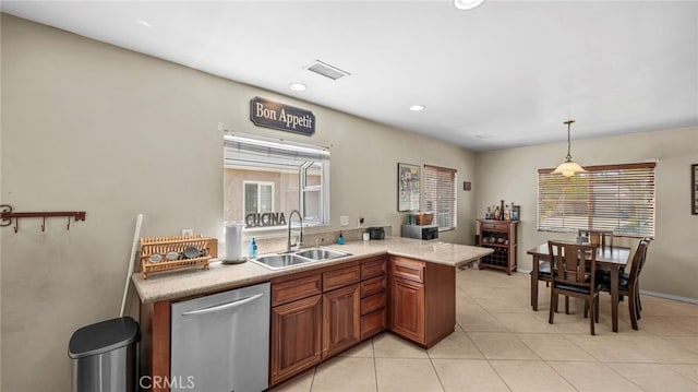 6048 Fidler Ave, Lakewood, CA 90712 - kitchen featuring a sink, dishwasher, light countertops, light tile patterned floors, and brown cabinets