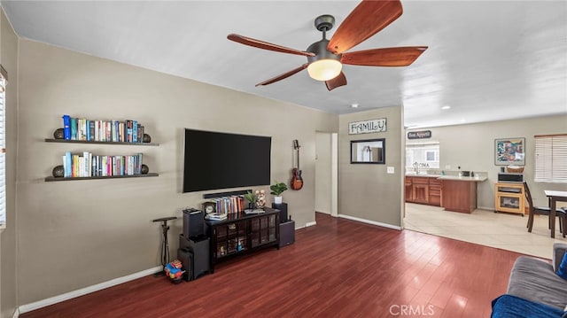 6048 Fidler Ave, Lakewood, CA 90712 - living area with ceiling fan, baseboards, and wood finished floors
