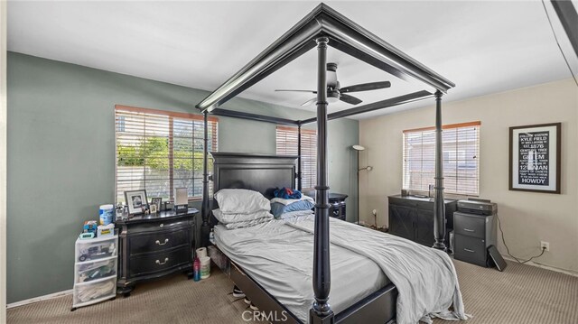 6048 Fidler Ave, Lakewood, CA 90712 - carpeted bedroom featuring multiple windows, baseboards, and ceiling fan