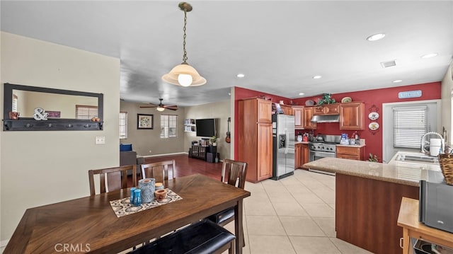 6048 Fidler Ave, Lakewood, CA 90712 - dining area with a ceiling fan, plenty of natural light, recessed lighting, and light tile patterned floors