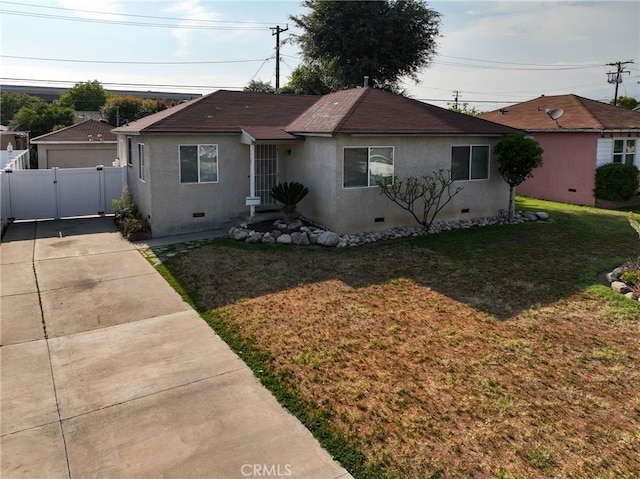 719 S 2nd Ave, Covina, CA 91723 - view of front facade featuring crawl space, a front yard, a gate, fence, and stucco siding