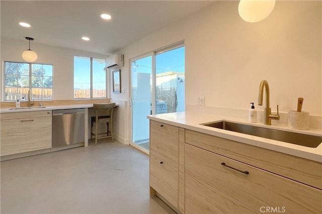 kitchen featuring an AC wall unit, a sink, concrete flooring, and dishwasher