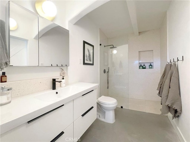 bathroom featuring vanity, toilet, beamed ceiling, walk in shower, and concrete floors
