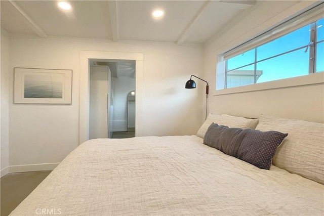 bedroom featuring baseboards, beamed ceiling, and recessed lighting