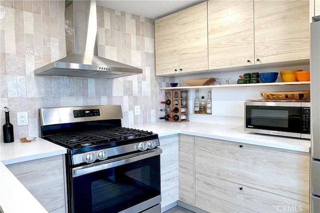 kitchen with modern cabinets, open shelves, stainless steel appliances, and wall chimney exhaust hood