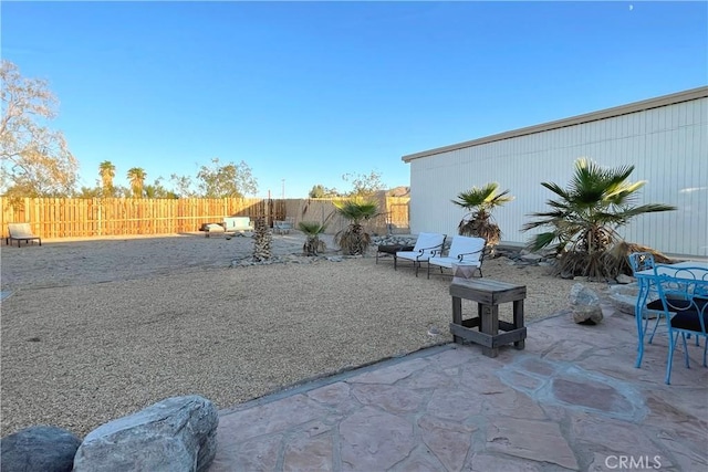view of yard with a fenced backyard and a patio area