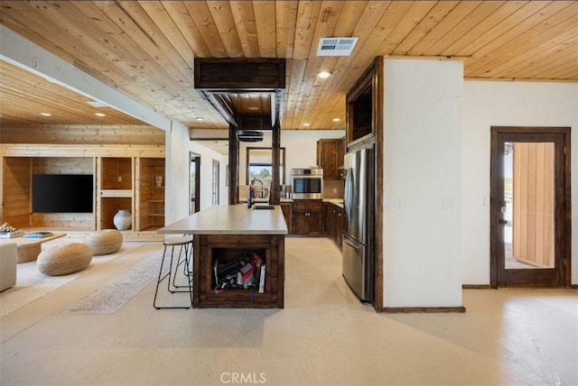 kitchen with visible vents, open floor plan, appliances with stainless steel finishes, and wooden ceiling