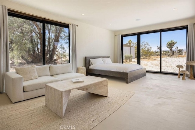 bedroom with recessed lighting and access to exterior