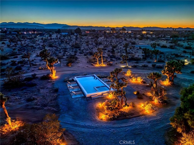 3484 El Dorado Rd, Yucca Valley, CA 92284 - aerial view of property and surrounding area featuring a mountainous background and a desert landscape