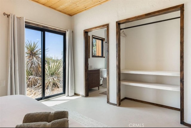 bedroom featuring wooden ceiling, baseboards, and access to exterior