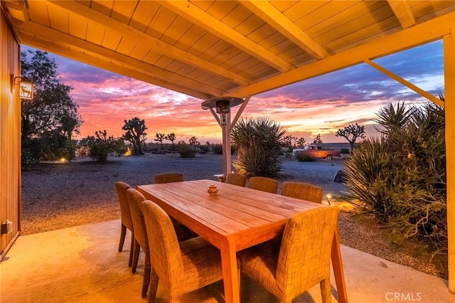patio terrace at dusk with outdoor dining space