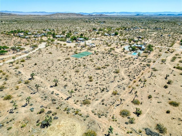 birds eye view of property featuring a rural view, a mountain view, and a desert view