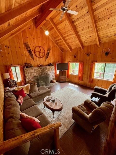 38784 Aspen Ln, Mineral, CA 96063 - living room featuring wooden walls, wooden ceiling, a stone fireplace, hardwood / wood-style flooring, and a ceiling fan