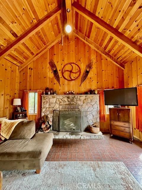 38784 Aspen Ln, Mineral, CA 96063 - living area with wooden ceiling, wood walls, and a fireplace