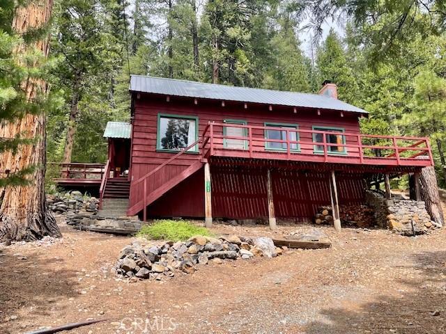 38784 Aspen Ln, Mineral, CA 96063 - back of property featuring a deck, a chimney, stairs, and metal roof