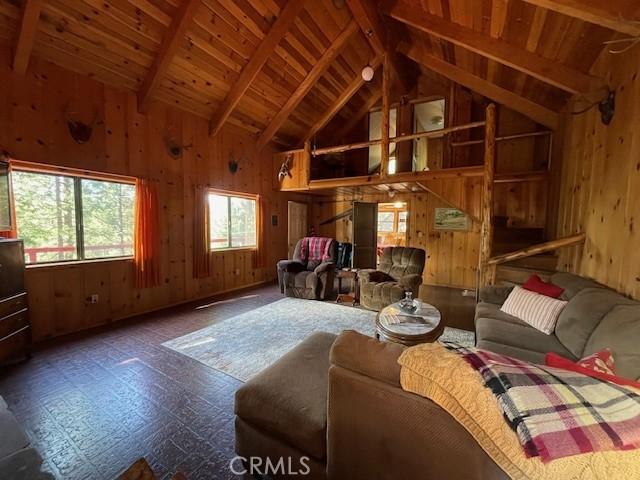 38784 Aspen Ln, Mineral, CA 96063 - living room featuring wooden walls, wooden ceiling, beamed ceiling, and high vaulted ceiling
