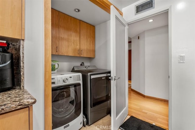 450 N Oakhurst Dr Unit 304, Beverly Hills, CA 90210 - washroom featuring light wood-style flooring, separate washer and dryer, cabinet space, baseboards, and recessed lighting