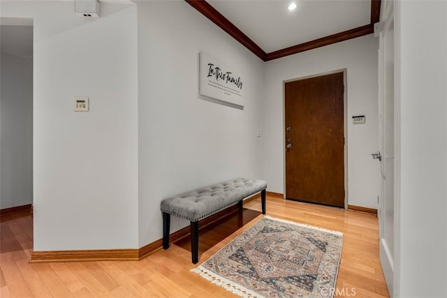 450 N Oakhurst Dr Unit 304, Beverly Hills, CA 90210 - foyer with ornamental molding, baseboards, and light wood finished floors