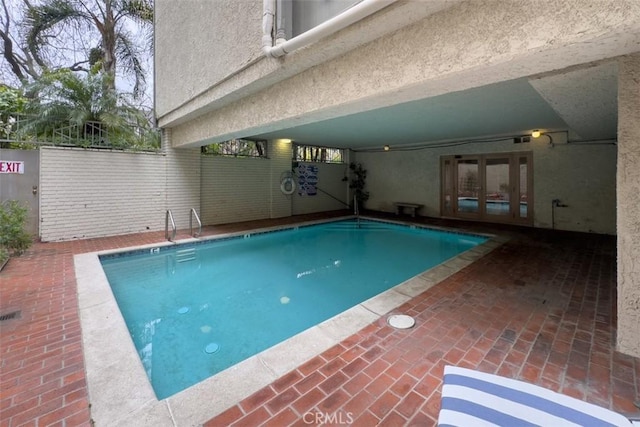 450 N Oakhurst Dr Unit 304, Beverly Hills, CA 90210 - indoor pool featuring french doors and a patio