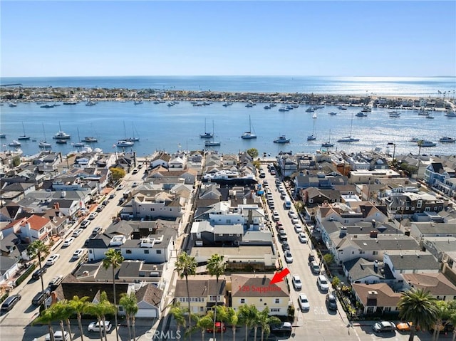 bird's eye view with a water view and a residential view