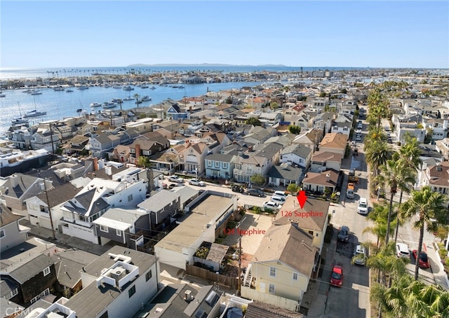 birds eye view of property with a residential view and a water view