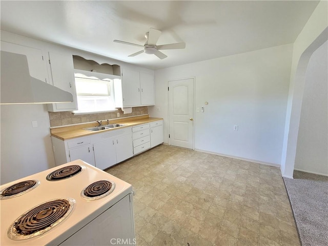 904 Toomes Ave, Corning, CA 96021 - kitchen featuring white electric range oven, a sink, light countertops, a ceiling fan, and white cabinetry