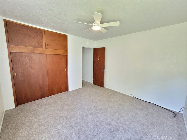 904 Toomes Ave, Corning, CA 96021 - unfurnished bedroom featuring carpet, a closet, and ceiling fan