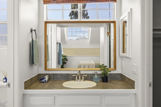 bathroom with vanity and plenty of natural light