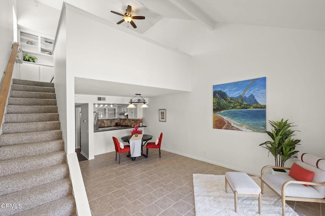 interior space featuring ceiling fan, beam ceiling, high vaulted ceiling, stairs, and visible vents