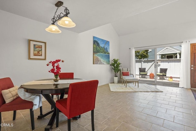 dining area featuring lofted ceiling